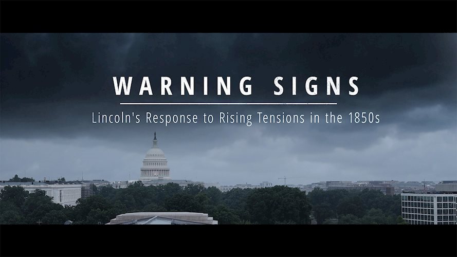Capitol Building with dark clouds and Warning Signs Text